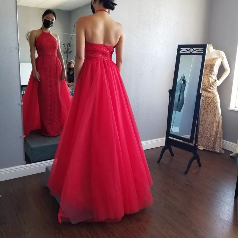 A red tulle ballgown fitted at the bodice